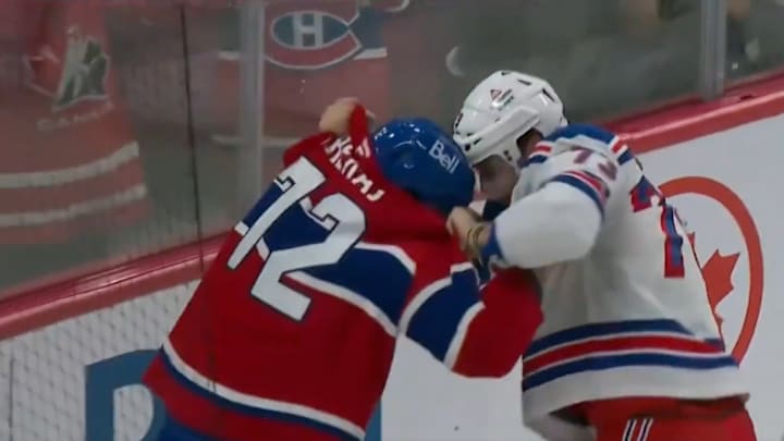 Canadiens D Arber Xhekaj and Rangers F Matt Rempe drop their gloves and scrap. 