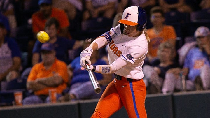 Florida Gators infielder Skylar Wallace (17) hits her second home run of the night. The Florida