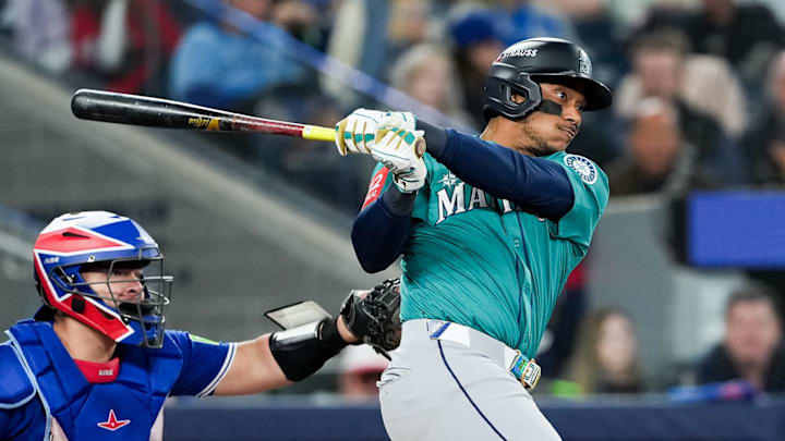 Oct 13, 2025; Toronto, Ontario, CAN; Seattle Mariners infielder Jorge Polanco (7) singles in the seventh inning against the Toronto Blue Jays during game two of the ALCS round for the 2025 MLB playoffs at Rogers Centre. Mandatory Credit: Nick Turchiaro-Imagn Images