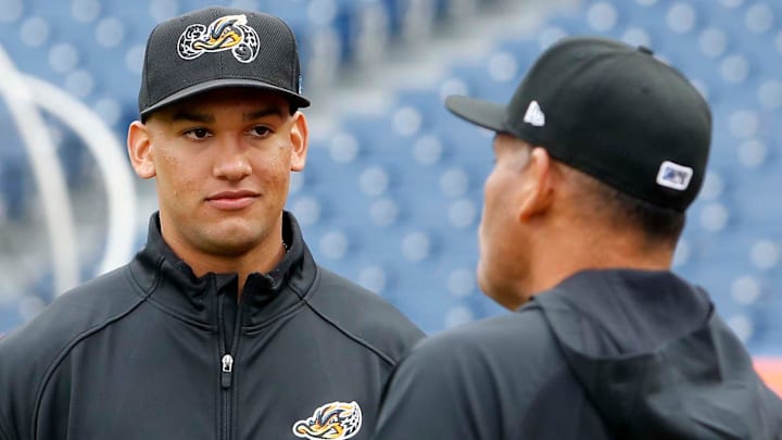 Cleveland Guardians top pitching prospect Daniel Espino, left, talks with Akron RubberDucks manager Rouglas Odor during the RubberDucks Media Day at Canal Park in Akron.