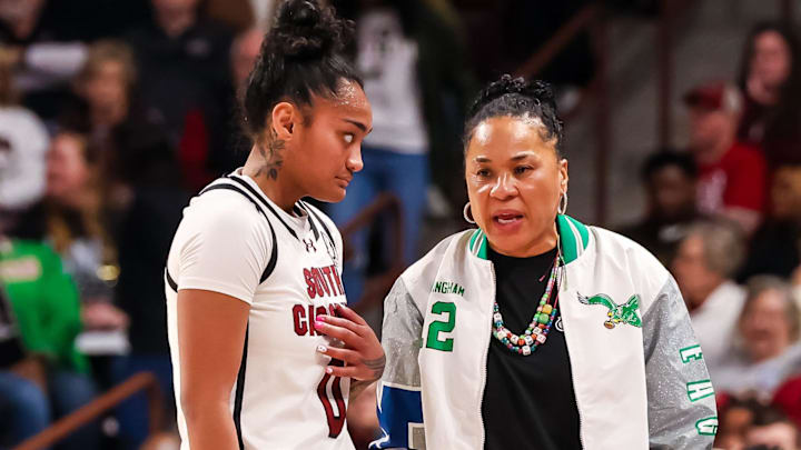 Jan 12, 2025; Columbia, South Carolina, USA; South Carolina Gamecocks head coach Dawn Staley speaks with guard Te-Hina Paopao (0) against the Texas Longhorns in the first half at Colonial Life Arena. Mandatory Credit: Jeff Blake-Imagn Images
