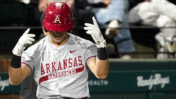 Arkansas catcher Ryder Helfrick (27) celebrates his triple against Vanderbilt during the third inning at Hawkins Field in Nashville, Tenn., Friday, March 28, 2025.