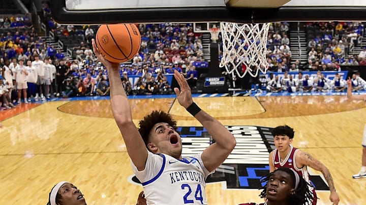 Mar 20, 2026; St. Louis, MO, USA; Kentucky Wildcats center Malachi Moreno (24) goes for a lay up as Santa Clara Broncos forward Elijah Mahi (8) guard Jake Ensminger (44) and center Bukky Oboye (12) defend during the first half during in first round game of the men's 2026 NCAA Tournament at Enterprise Center. Mandatory Credit: Jeff Curry-Imagn Images