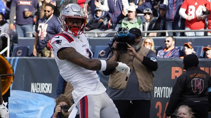 Patriots WR Ja'Lynn Polk, the former Husky pass-catcher, celebrates after catching a touchdown pass against the Chicago Bears and Rome Odunze.