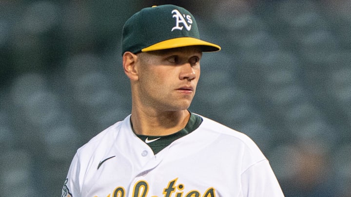 May 16, 2023; Oakland, California, USA; Oakland Athletics relief pitcher Garrett Acton (67) prepares to pitch during the fifth inning against the Arizona Diamondbacks at Oakland-Alameda County Coliseum. Mandatory Credit: Stan Szeto-Imagn Images