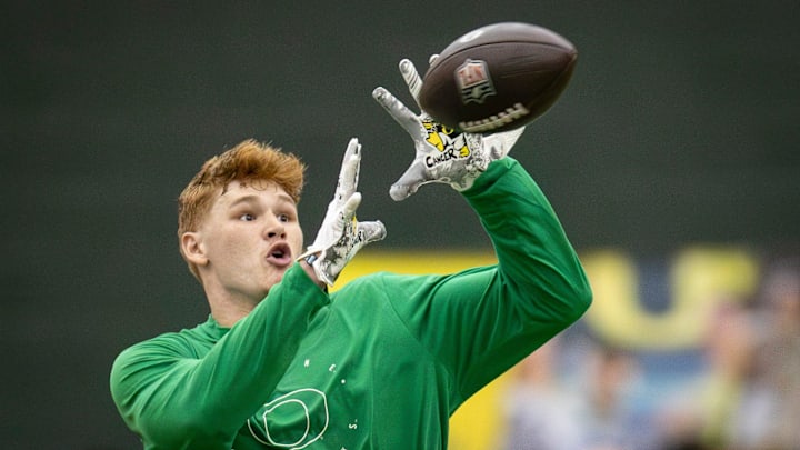 Oregon tight end Terrance Ferguson catches a pass from former Oregon quarterback Bo Nix during Oregon Pro Day Tuesday, March 12, 2024 at the Moshofsky Center in Eugene, Ore.