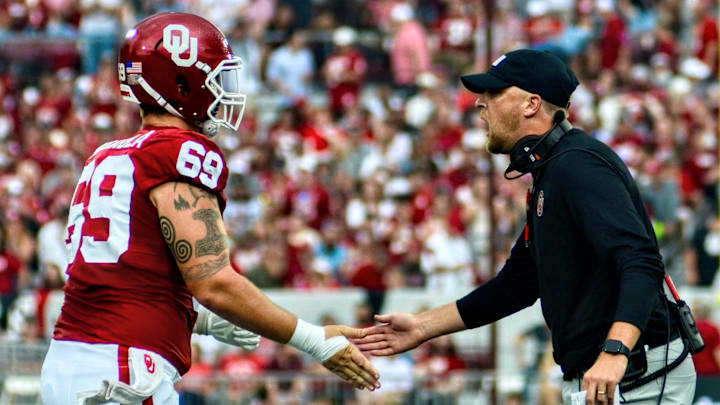 Oklahoma offensive lineman Jake Maikkula, offensive coordinator Ben Arbuckle Oklahoma offensive lineman Jake Maikkula, offensive coordinator Ben Arbuckle