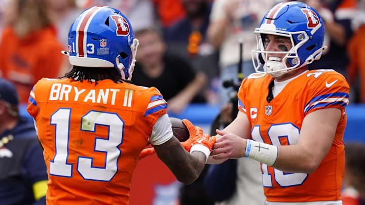 Oct 26, 2025; Denver, Colorado, USA;  Denver Broncos wide receiver Pat Bryant (13) celebrates scoring a touchdown with quarterback Bo Nix (10) in the second quarter against the Dallas Cowboys at Empower Field at Mile High. 