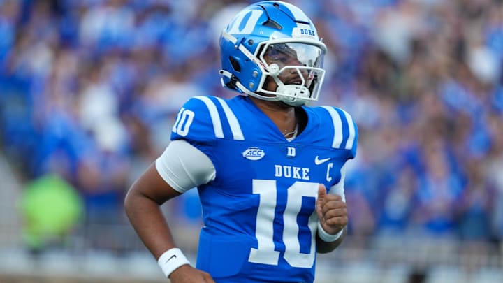 Aug 28, 2025; Durham, North Carolina, USA; Duke Blue Devils quarterback Darian Mensah (10) comes running out onto the field before the start of the game against the Elon Phoenix at Wallace Wade Stadium. Mandatory Credit: James Guillory-Imagn Images Aug 28, 2025; Durham, North Carolina, USA; Duke Blue Devils quarterback Darian Mensah (10) comes running out onto the field before the start of the game against the Elon Phoenix at Wallace Wade Stadium. Mandatory Credit: James Guillory-Imagn Images