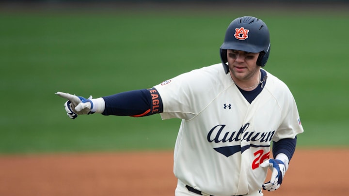 Auburn Tigers infielder Cooper McMurray (26) celebrates his home run at Plainsman Park in Auburn,