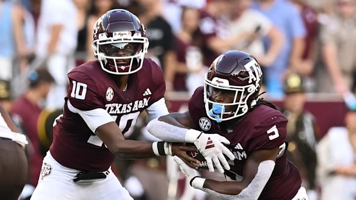 Sep 21, 2024; College Station, Texas, USA; Texas A&M Aggies quarterback Marcel Reed (10) hands off the ball to running back Amari Daniels (5) during the first quarter against the Bowling Green Falcons at Kyle Field. Mandatory Credit: Maria Lysaker-Imagn Images. 