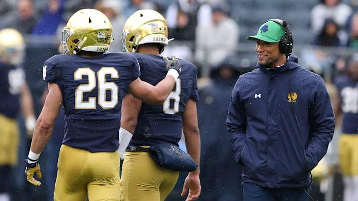 Notre Dame Head Coach Marcus Freeman, right, watches cornerback Isaiah Dunn (26) console quarterback Kenny Minchey (8) during the Notre Dame Blue-Gold Spring Football game on Saturday, April 22, 2023, at Notre Dame Stadium in South Bend
