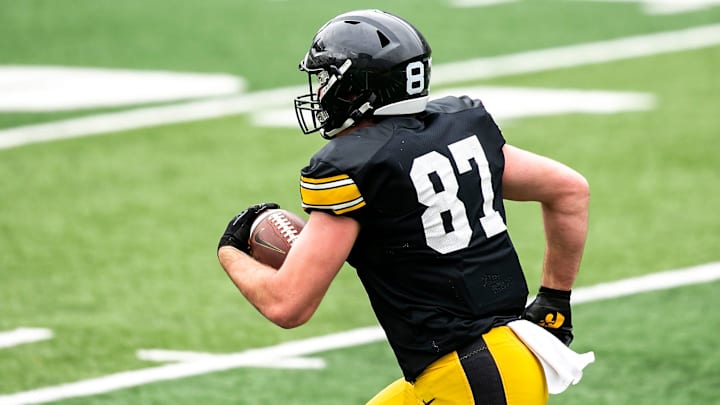 Iowa tight end Addison Ostrenga (87) runs for extra yards during the Hawkeyes' final spring NCAA football practice, Saturday, April 22, 2023, at Kinnick Stadium in Iowa City, Iowa.

230422 Iowa Spring Fb 088 Jpg