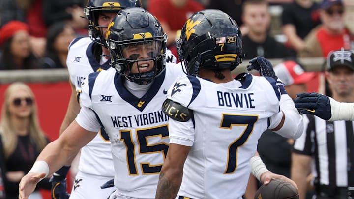 Nov 1, 2025; Houston, Texas, USA; West Virginia Mountaineers quarterback Scotty Fox Jr. (15) celebrates his touchdown with wide receiver Jarod Bowie (7) and teammates against the Houston Cougars in the first half at TDECU Stadium. Mandatory Credit: Thomas Shea-Imagn Images