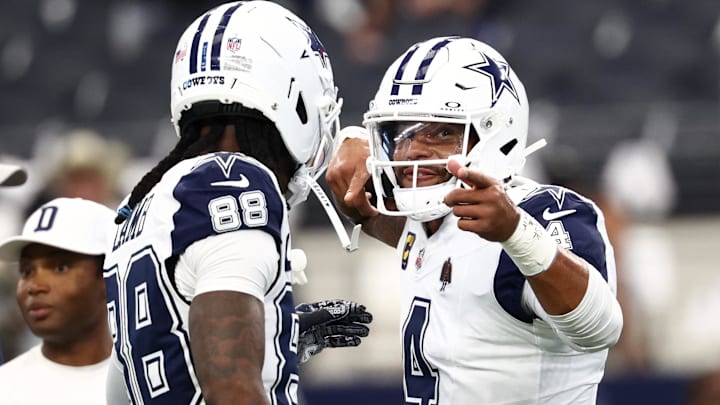 Dallas Cowboys quarterback Dak Prescott speaks with wide receiver Ceedee Lamb.