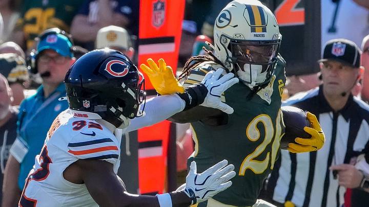 Kaleb Johnson stiff-arms Bears safety Xavier Woods in Sunday's Chicago loss. Kaleb Johnson stiff-arms Bears safety Xavier Woods in Sunday's Chicago loss.