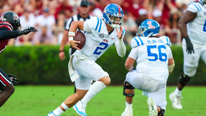 Oct 5, 2024; Columbia, South Carolina, USA; Mississippi Rebels quarterback Jaxson Dart (2) rushes against the South Carolina Gamecocks in the second quarter at Williams-Brice Stadium. Mandatory Credit: Jeff Blake-Imagn Images Oct 5, 2024; Columbia, South Carolina, USA; Mississippi Rebels quarterback Jaxson Dart (2) rushes against the South Carolina Gamecocks in the second quarter at Williams-Brice Stadium. Mandatory Credit: Jeff Blake-Imagn Images