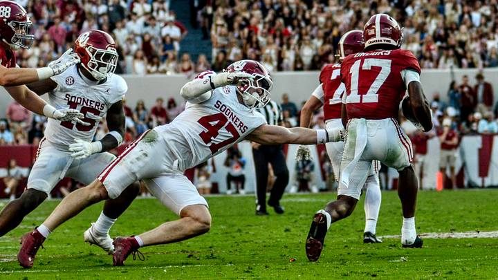 Oklahoma linebacker James Nesta tries to tackle Alabama's Lotzeir Brooks. Oklahoma linebacker James Nesta tries to tackle Alabama's Lotzeir Brooks.