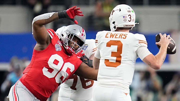Ohio State Buckeyes defensive end Eddrick Houston (96) pressures Texas Longhorns quarterback Quinn Ewers (3) during the second half of the Cotton Bowl Classic College Football Playoff semifinal game at AT&T Stadium in Arlington, Texas on Jan. 10, 2025. Ohio State won 28-14.