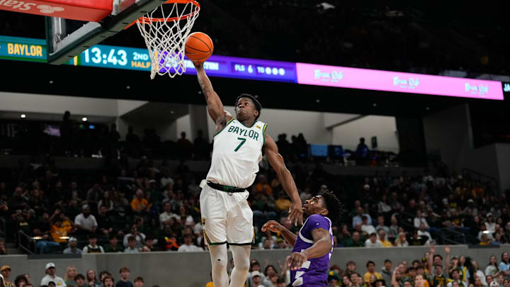 Nov 17, 2024; Waco, Texas, USA;  Baylor Bears guard VJ Edgecombe (7) dunks the ball against Tarleton Texans forward Ronnie Harrison Jr. (3) during the second half at Paul and Alejandra Foster Pavilion. Mandatory Credit: Chris Jones-Imagn Images