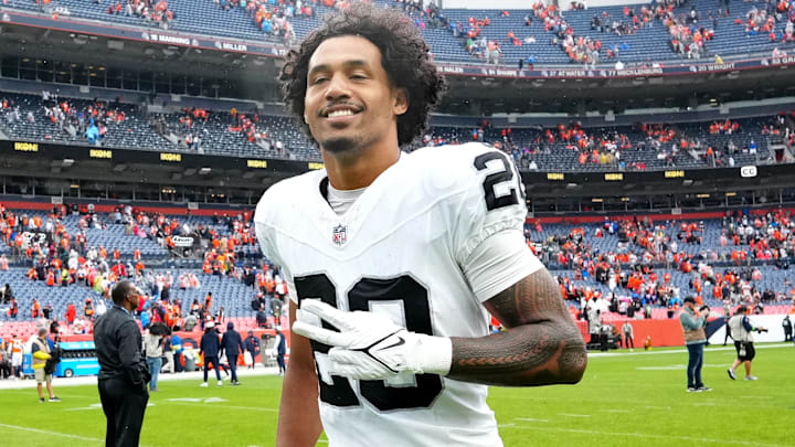 Sep 10, 2023; Denver, Colorado, USA; Las Vegas Raiders safety Isaiah Pola-Mao (20) reacts following the win over the Denver Broncos at Empower Field at Mile High. Mandatory Credit: Ron Chenoy-Imagn Images