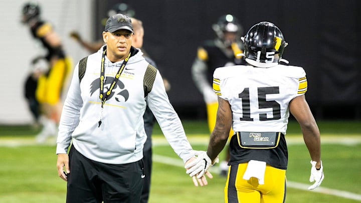 Iowa special teams coordinator LeVar Woods high-fives Iowa defensive back Dallas Craddieth (15) during a spring NCAA college football practice, Tuesday, March 29, 2022, at the University of Iowa Indoor Practice Facility in Iowa City, Iowa. Iowa special teams coordinator LeVar Woods high-fives Iowa defensive back Dallas Craddieth (15) during a spring NCAA college football practice, Tuesday, March 29, 2022, at the University of Iowa Indoor Practice Facility in Iowa City, Iowa.