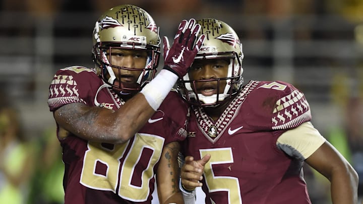 Oct 18, 2014; Tallahassee, FL, USA;  Florida State Seminoles wide receiver Rashad Greene (80) celebrates his touchdown with quarterback Jameis Winston (5) in the end zone against the Notre Dame Fighting Irish during the third quarter at Doak Campbell Stadium. Florida State defeated Notre Dame 31-27. Mandatory Credit: John David Mercer-Imagn Images