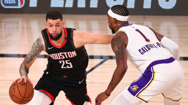 Sep 12, 2020; Lake Buena Vista, Florida, USA; Houston Rockets guard Austin Rivers (25) dribbles the ball around Los Angeles Lakers guard Kentavious Caldwell-Pope (1) in game five of the second round of the 2020 NBA Playoffs at ESPN Wide World of Sports Complex. Mandatory Credit: Kim Klement-USA TODAY Sports