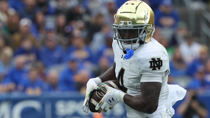 Nov 15, 2025; Pittsburgh, Pennsylvania, USA;  Notre Dame Fighting Irish running back Jeremiyah Love (4) runs after a catch against the Pittsburgh Panthers during the second quarter at Acrisure Stadium. Mandatory Credit: Charles LeClaire-Imagn Images