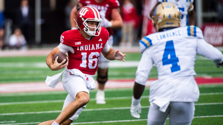 Indiana's Alberto Mendoza (16) runs for a touchdown during the Indiana versus UCLA football game at Memorial Stadium on Saturday, Oct. 25, 2025.