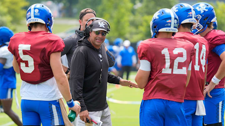 Kentucky Wildcats offensive coordinator and quarterback coach Bush Hamdan coaches the quarterbacks during practice on Friday, August 1, 2025