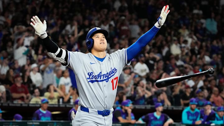 Los Angeles Dodgers Shohei Ohtani tosses his bat after hitting a three run home run against the Arizona Diamondbacks in the ninth inning at Chase Field in Phoenix on May 9, 2025. Mandatory Credit: Rob Schumacher-Arizona Republic