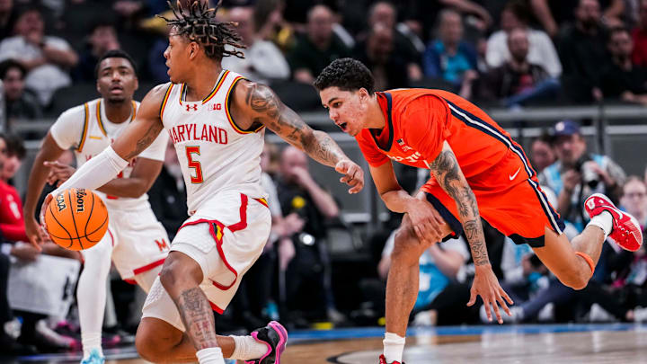 Illinois Fighting Illini forward Will Riley (7) guards Maryland Terrapins guard DeShawn Harris-Smith (5) on Friday, March 14, 2025, in a quarterfinals game at the 2025 TIAA Big Ten Men’s Basketball Tournament between the Maryland Terrapins and the Illinois Fighting Illini at Gainbridge Fieldhouse in Indianapolis. The Maryland Terrapins defeated the Illinois Fighting Illini, 88-65.