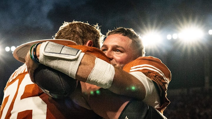 Texas Longhorns quarterback Quinn Ewers (3) embraces Texas Longhorns offensive lineman Hayden Conner (76) after the Longhorns' game against the Kentucky Wildcats at Darrell K Royal Texas Memorial Stadium in Austin, Nov. 23, 2024.