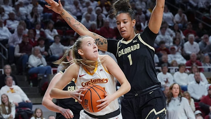 Iowa State guard Kelsey Joens (23) looks for a shot around Colorado forward Ayianna Johnson (1) at Hilton Coliseum on Saturday, Feb. 8, 2025, in Ames, Iowa.