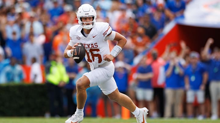 Oct 4, 2025; Gainesville, Florida, USA; Texas Longhorns quarterback Arch Manning (16) scrambles with the ball against the Florida Gators during the first half at Ben Hill Griffin Stadium. Mandatory Credit: Matt Pendleton-Imagn Images