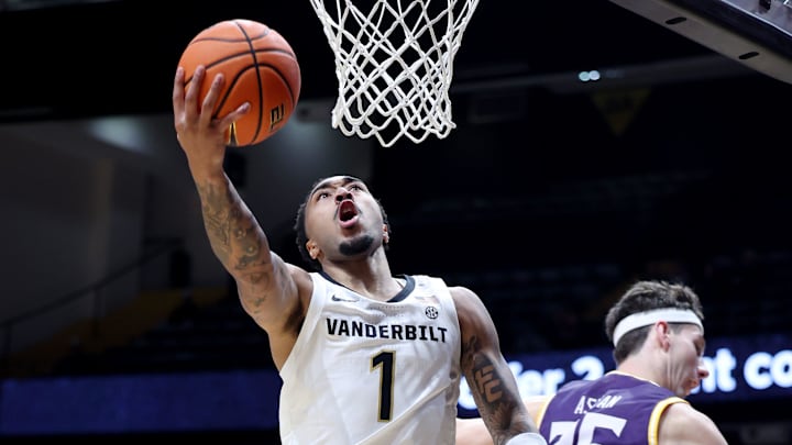 Vanderbilt's Frankie Collins (1) shoots a basket while being guarded by Lipscomb's Grant Asman (35) during their game Monday, Nov. 3, 2025 at Vanderbilt’s Memorial Gym.