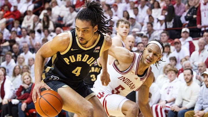 Purdue forward Trey Kaufman-Renn (4) dribbles the ball while Indiana forward Malik Reneau (5) defends.
