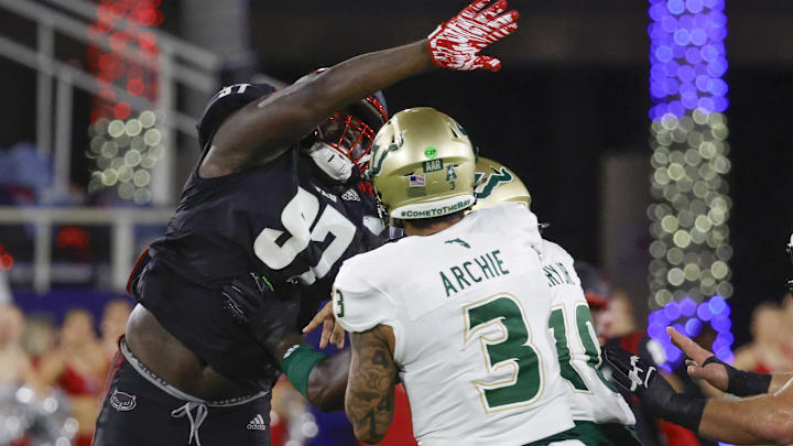 Nov 1, 2024; Boca Raton, Florida, USA; Florida Atlantic Owls defensive lineman Devonta Davis (97) tries to block a pass from South Florida Bulls quarterback Bryce Archie (3) during the second quarter at FAU Stadium. Mandatory Credit: Reinhold Matay-Imagn Images Nov 1, 2024; Boca Raton, Florida, USA; Florida Atlantic Owls defensive lineman Devonta Davis (97) tries to block a pass from South Florida Bulls quarterback Bryce Archie (3) during the second quarter at FAU Stadium. Mandatory Credit: Reinhold Matay-Imagn Images
