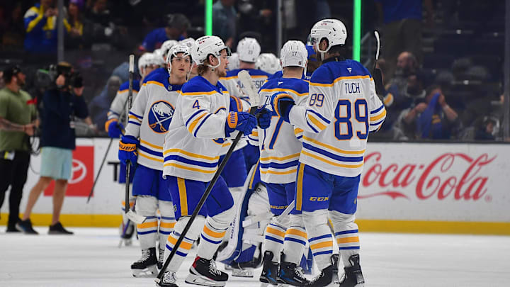 Mar 21, 2026; Los Angeles, California, USA; Buffalo Sabres defenseman Bowen Byram (4) and right wing Alex Tuch (89) celebrate the victory against the Los Angeles Kings at Crypto.com Arena. Mandatory Credit: Gary A. Vasquez-Imagn Images