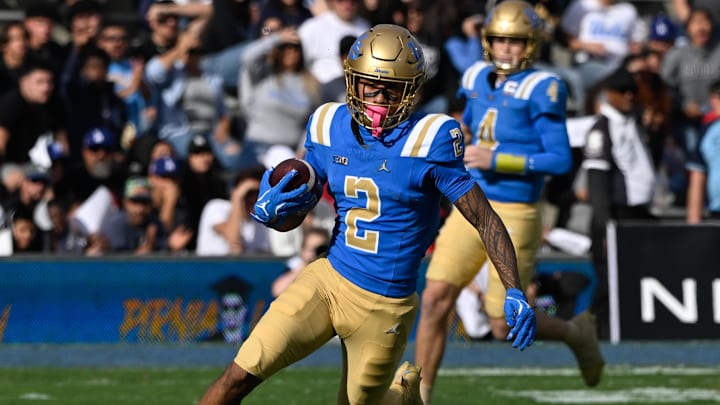 Nov 30, 2024; Pasadena, California, USA; UCLA Bruins wide receiver Titus Mokiao-Atimalala runs upfield after catching a short pass from UCLA Bruins quarterback Ethan Garbers (4) during the section quarter against the Fresno State Bulldogs at Rose Bowl. Mandatory Credit: Robert Hanashiro-Imagn Images