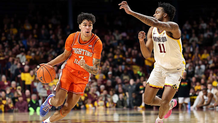 Feb 8, 2025; Minneapolis, Minnesota, USA; Illinois Fighting Illini forward Will Riley (7) drives towards the basket as Minnesota Golden Gophers guard Femi Odukale (11) defends during the second half at Williams Arena. Mandatory Credit: Matt Krohn-Imagn Images