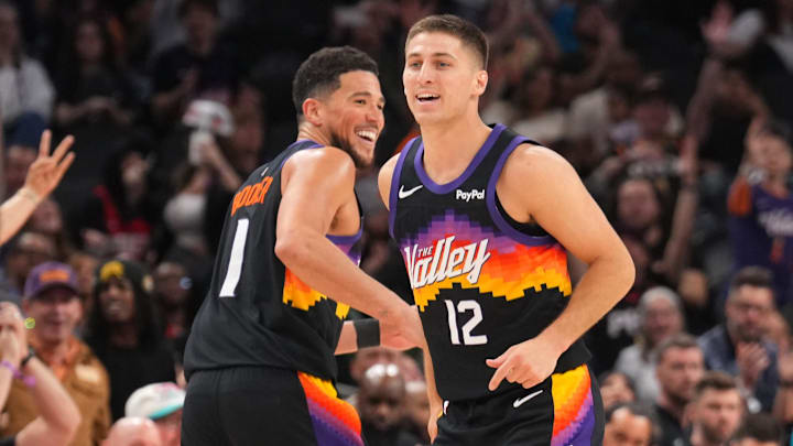 Mar 8, 2026; Phoenix, Arizona, USA; Phoenix Suns guard Devin Booker (1) and Phoenix Suns guard Collin Gillespie (12) react against the Charlotte Hornets during the second half at Mortgage Matchup Center. Mandatory Credit: Joe Camporeale-Imagn Images