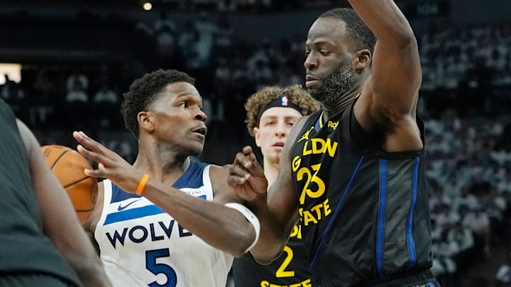 Minnesota Timberwolves guard Anthony Edwards controls the ball against Golden State Warriors forward Draymond Green in the first quarter during Game 1of their Western Conference semifinal at Target Center in Minneapolis on May 6, 2025.
