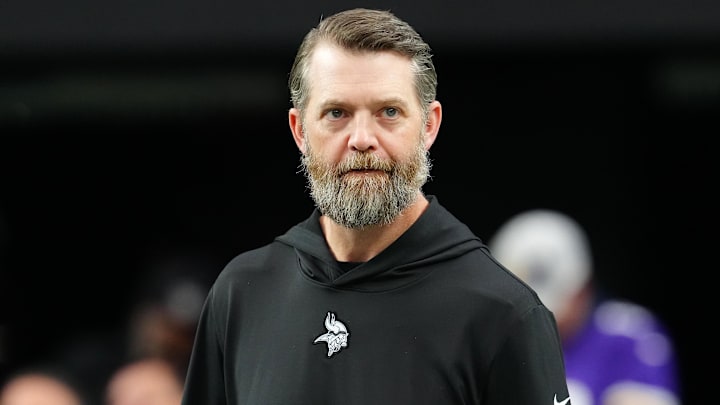 Dec 10, 2023; Paradise, Nevada, USA; Minnesota Vikings Offensive Coordinator Wes Phillips walks on the field before a game between the Vikings and the Las Vegas Raiders at Allegiant Stadium.