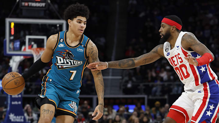 Dec 18, 2022; Detroit, Michigan, USA; Detroit Pistons guard Killian Hayes (7) dribbles defended by Brooklyn Nets forward Royce O'Neale (00) in the second half at Little Caesars Arena. Mandatory Credit: Rick Osentoski-Imagn Images
