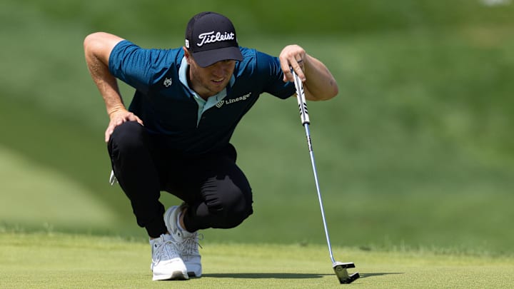 Jun 21, 2025; Cromwell, Connecticut, USA; Justin Thomas lines up a putt on the first hole during the third round of the Travelers Championship golf tournament.