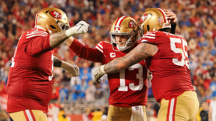 Jan 28, 2024; Santa Clara, California, USA; San Francisco 49ers quarterback Brock Purdy (13) celebrates with guard Jon Feliciano (55) and offensive tackle Trent Williams (71) after a play against the Detroit Lions during the second half of the NFC Championship football game at Levi's Stadium. Mandatory Credit: Kelley L Cox-USA TODAY Sports