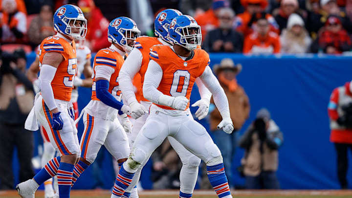 Jan 5, 2025; Denver, Colorado, USA; Denver Broncos linebacker Jonathon Cooper (0) reacts ahead of teammates after a sack in the second quarter against the Kansas City Chiefs at Empower Field at Mile High. Mandatory Credit: Isaiah J. Downing-Imagn Images