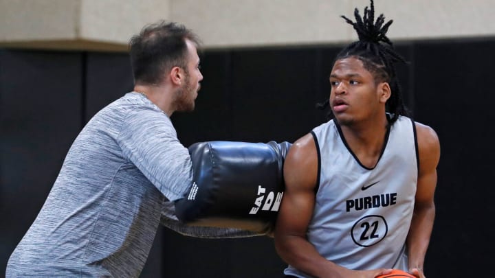 Sasha Stefanovic works with Purdue freshman Gicarri Harris